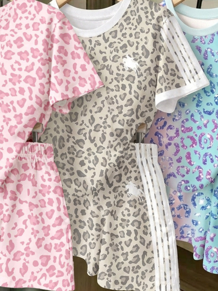 Girls' multicolor short sleeve T-shirt and shorts set featuring a cute cherry and bow print with round neck top and matching shorts.