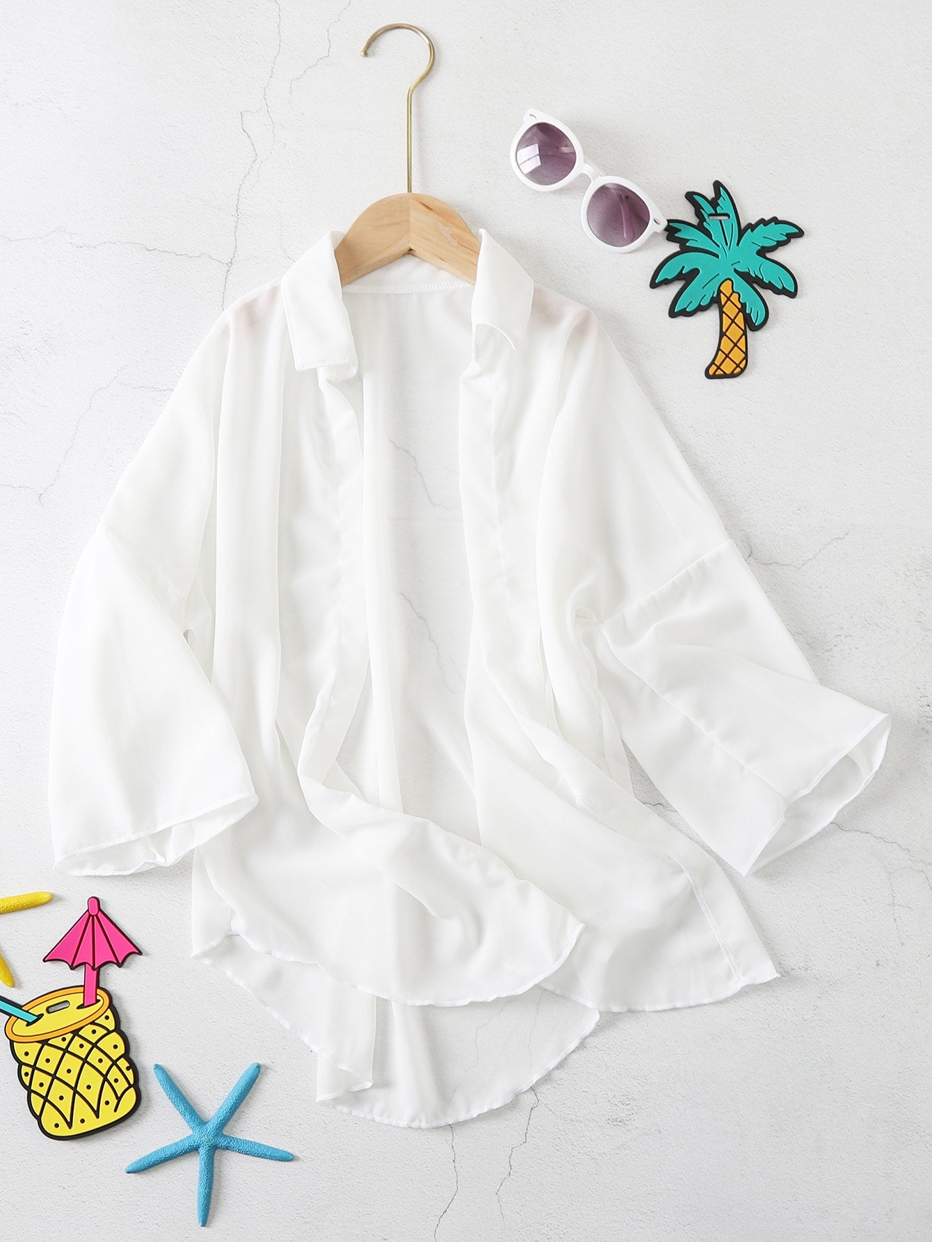 White ruffle kimono cover-up for tween girls, semi-sheer swimwear layer with three-quarter sleeves and regular length.