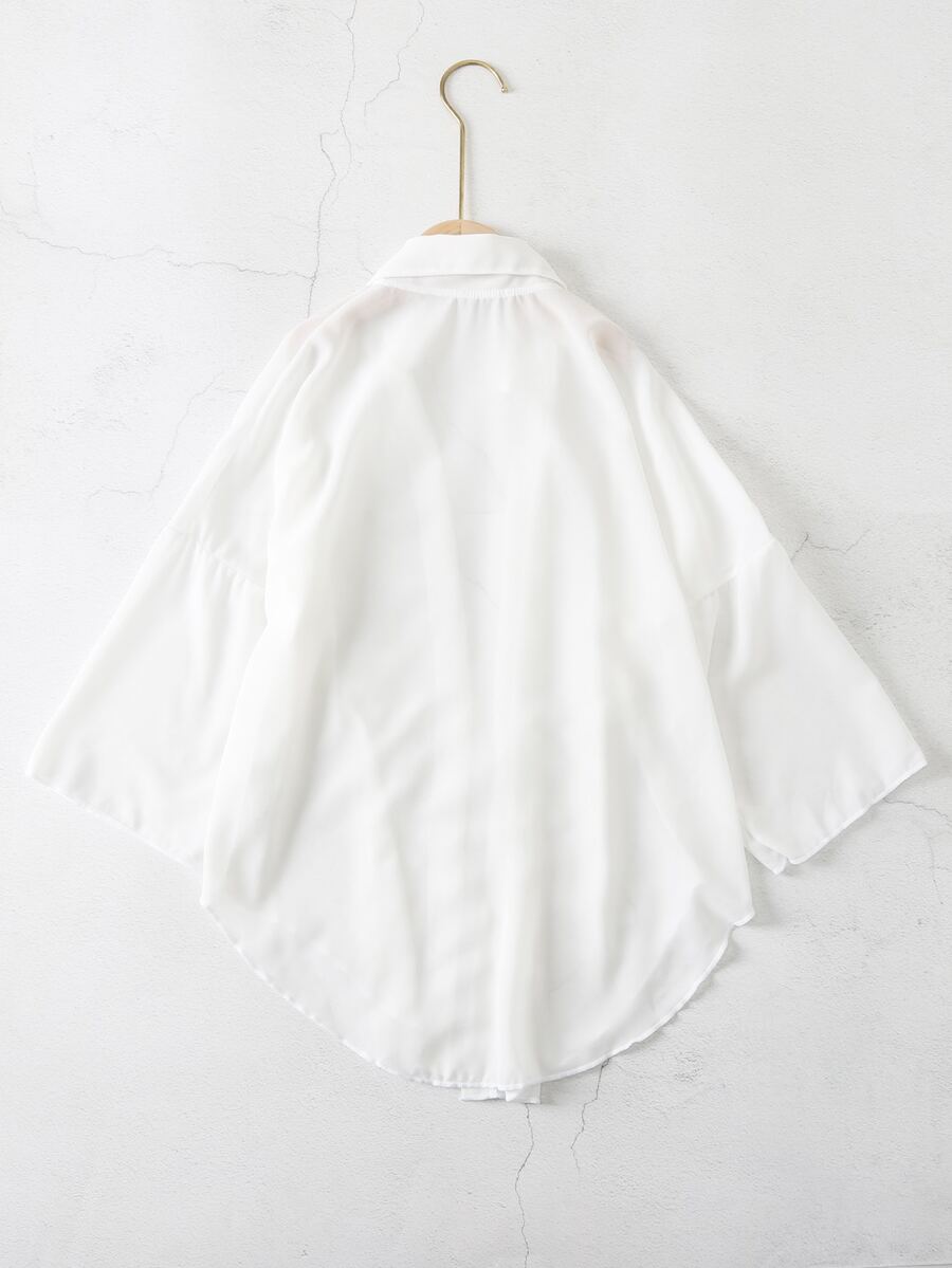 White ruffle kimono cover-up for tween girls, semi-sheer swimwear layer with three-quarter sleeves and regular length.