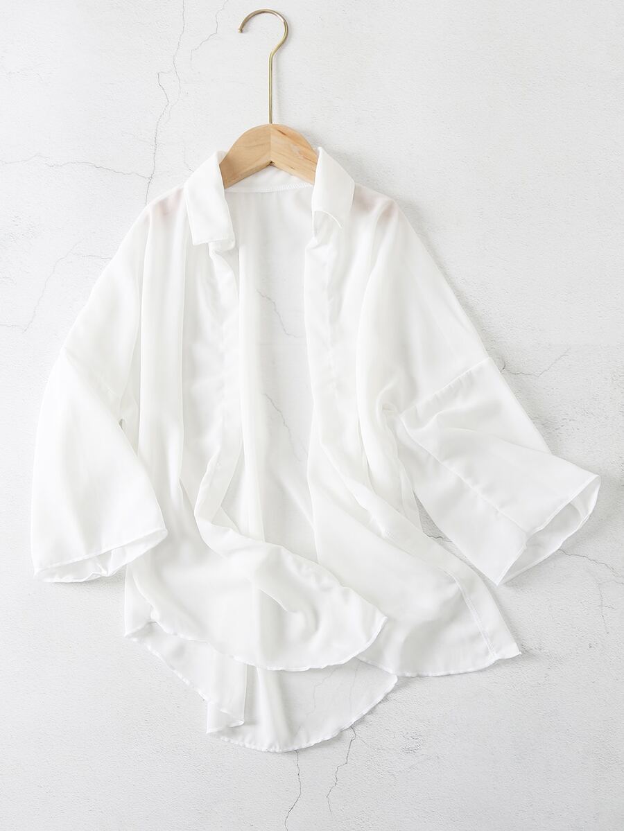 White ruffle kimono cover-up for tween girls, semi-sheer swimwear layer with three-quarter sleeves and regular length.