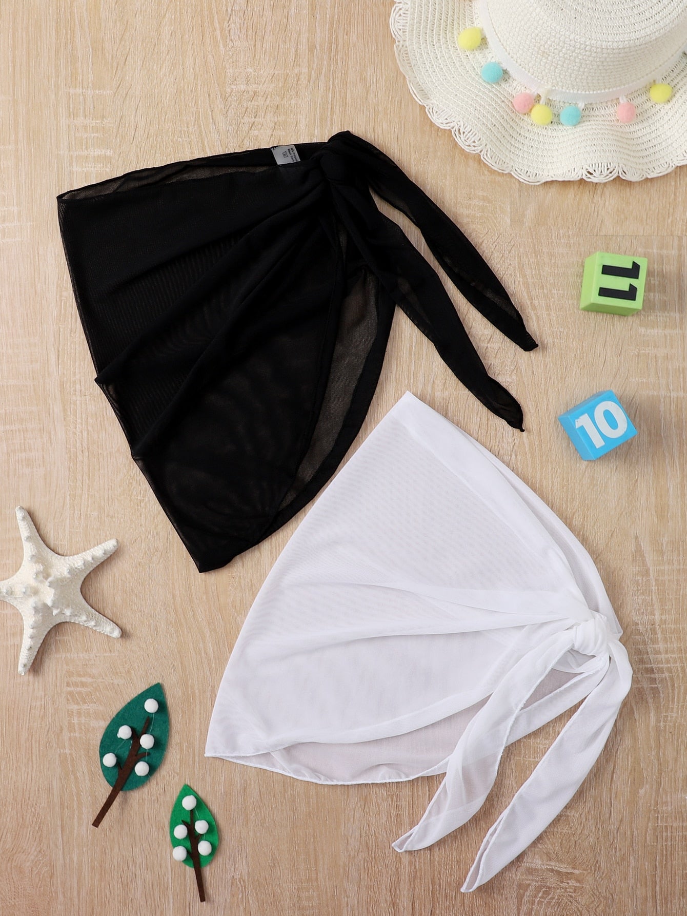 Girls' black and white 2-piece swimsuit cover up set featuring a long semi-sheer mesh skirt and matching shawl for beach vacation wear.