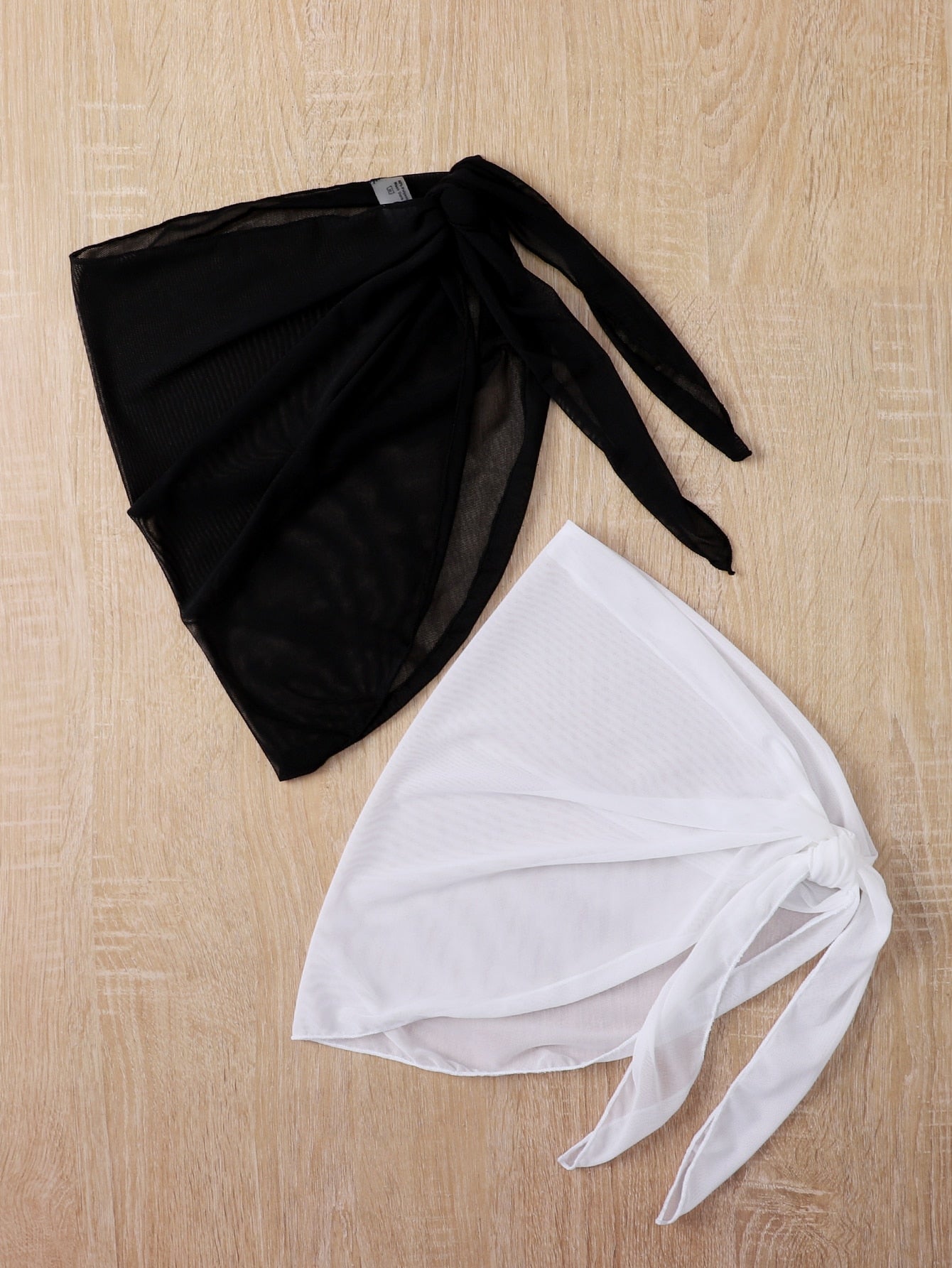 Girls' black and white 2-piece swimsuit cover up set featuring a long semi-sheer mesh skirt and matching shawl for beach vacation wear.