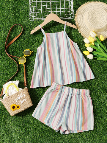 Tween girl wearing a multicolor rainbow striped camisole top with spaghetti straps and matching boho shorts.