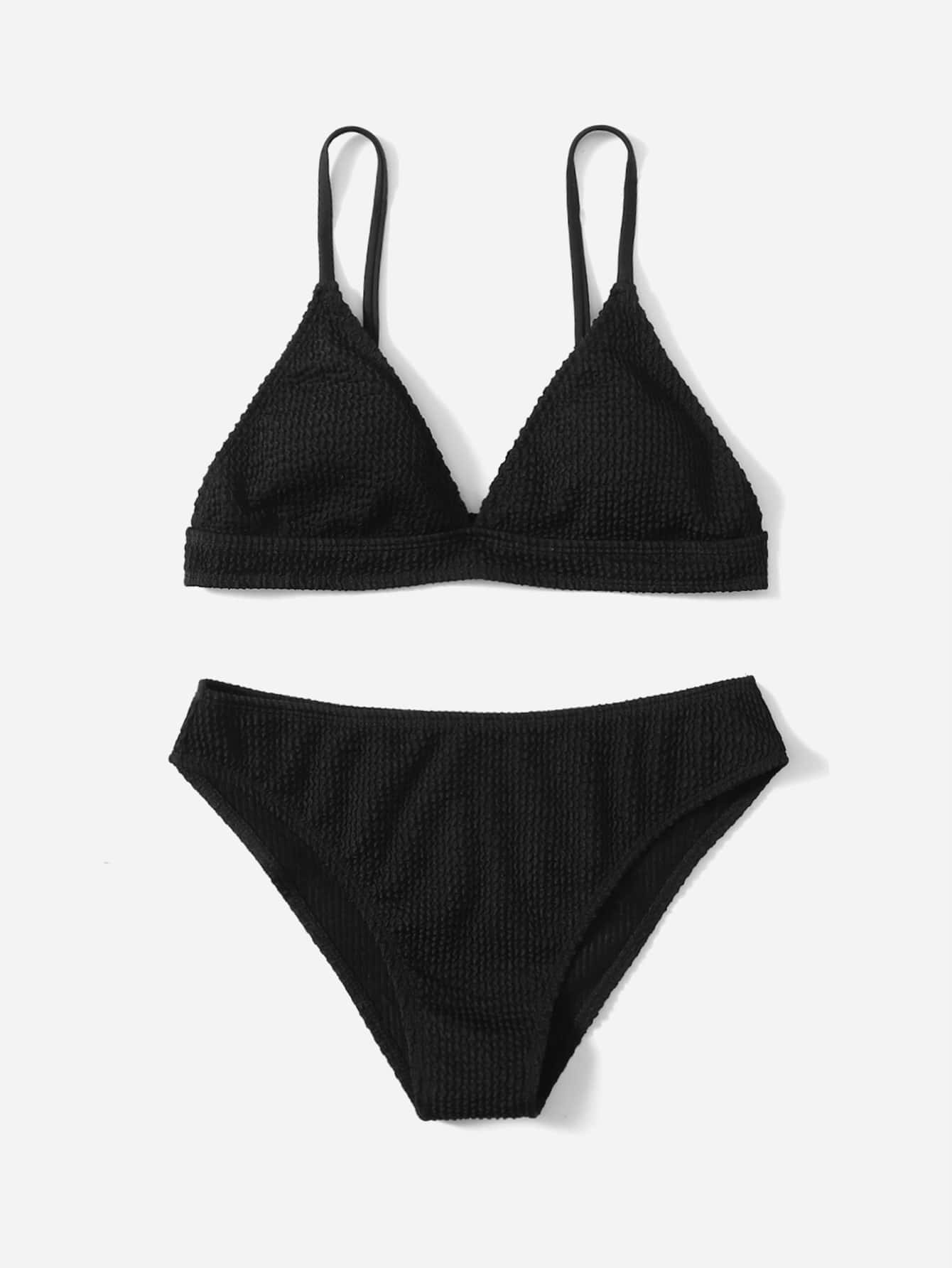 Tween girls two-piece bikini swimwear set with a solid color textured design, spaghetti strap top, wireless bra, and mid-waist lined bikini bottoms.