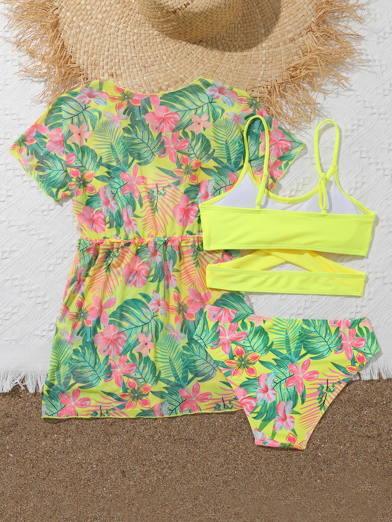 Three-piece tween girls swimwear set with a floral print, featuring a criss-cross bikini top, regular bikini bottoms, and a kimono cover-up in assorted prints.