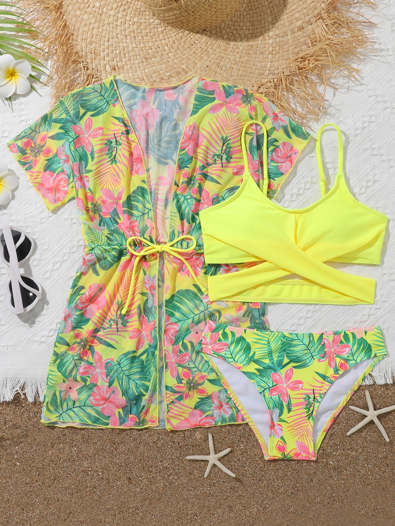 Three-piece tween girls swimwear set with a floral print, featuring a criss-cross bikini top, regular bikini bottoms, and a kimono cover-up in assorted prints.