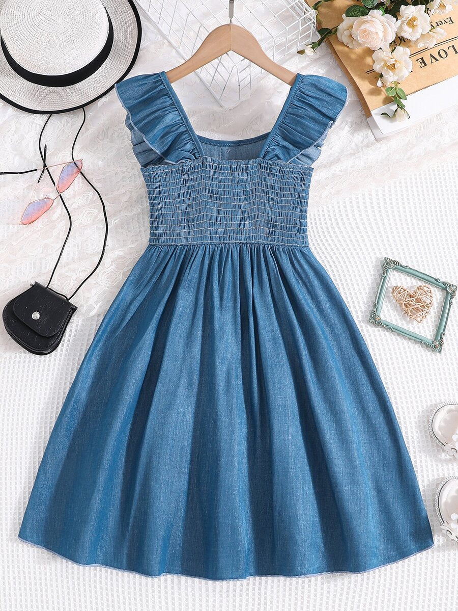 Vintaside tween girls sleeveless blue A-line dress featuring ruffle trim, square neckline, button front, and shirred back.