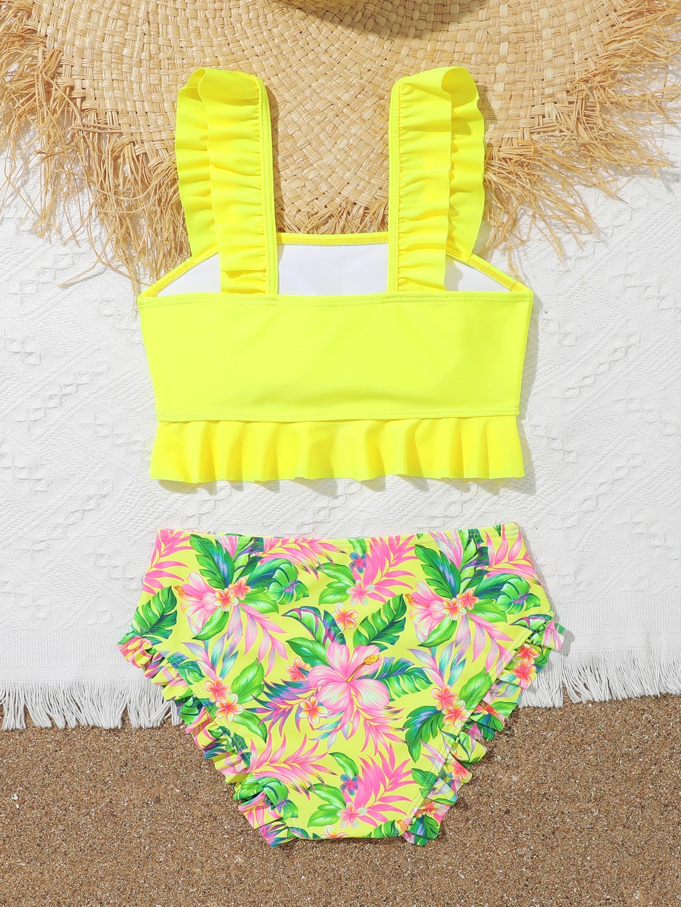 Tween girls solid color 2-piece bikini swimwear set with ruffle detail, strap neckline, wireless bikini top, and triangle mid-waist bikini bottoms; textured pattern with lined bottoms and high-stretch fabric, suitable for summer vacation.