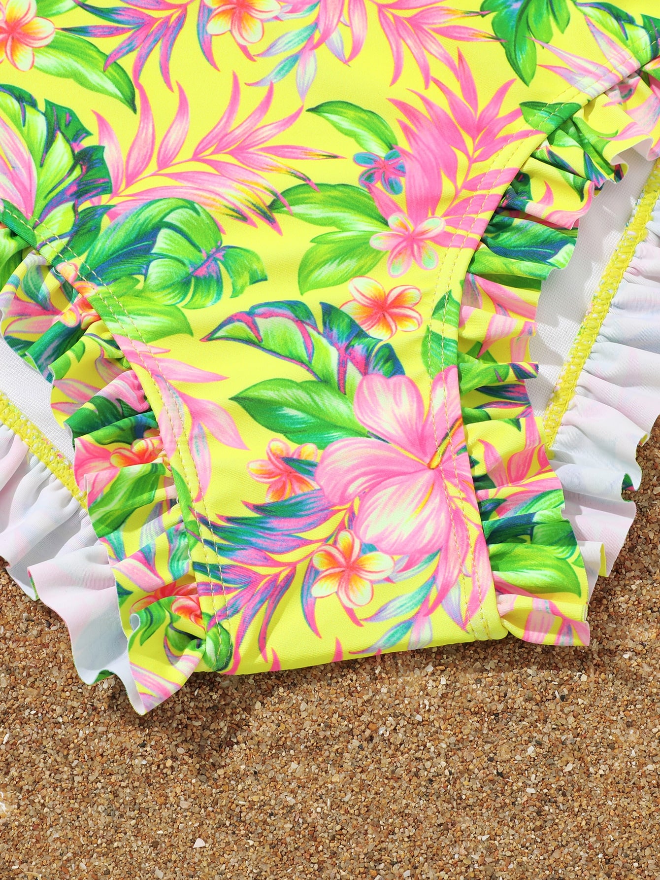Tween girls solid color 2-piece bikini swimwear set with ruffle detail, strap neckline, wireless bikini top, and triangle mid-waist bikini bottoms; textured pattern with lined bottoms and high-stretch fabric, suitable for summer vacation.