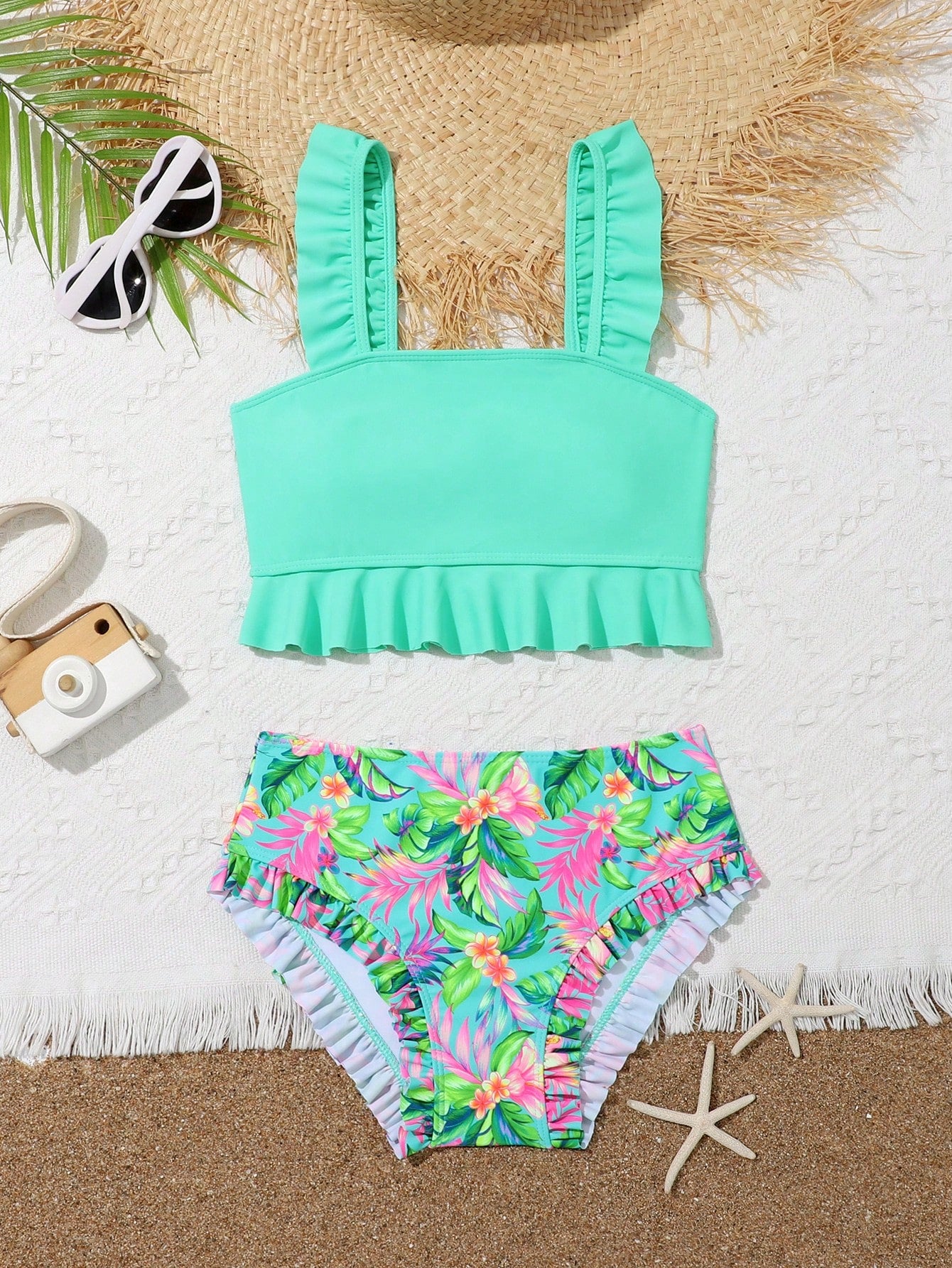 Tween girls solid color 2-piece bikini swimwear set with ruffle detail, strap neckline, wireless bikini top, and triangle mid-waist bikini bottoms; textured pattern with lined bottoms and high-stretch fabric, suitable for summer vacation.