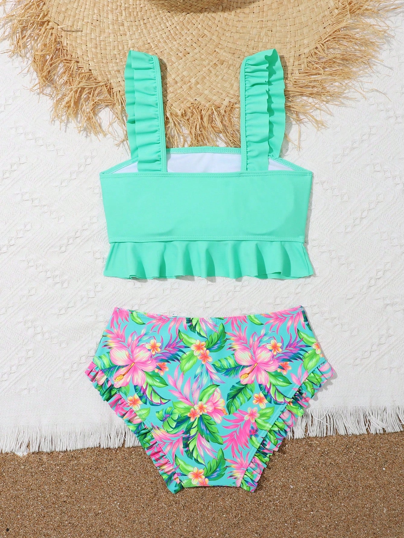 Tween girls solid color 2-piece bikini swimwear set with ruffle detail, strap neckline, wireless bikini top, and triangle mid-waist bikini bottoms; textured pattern with lined bottoms and high-stretch fabric, suitable for summer vacation.