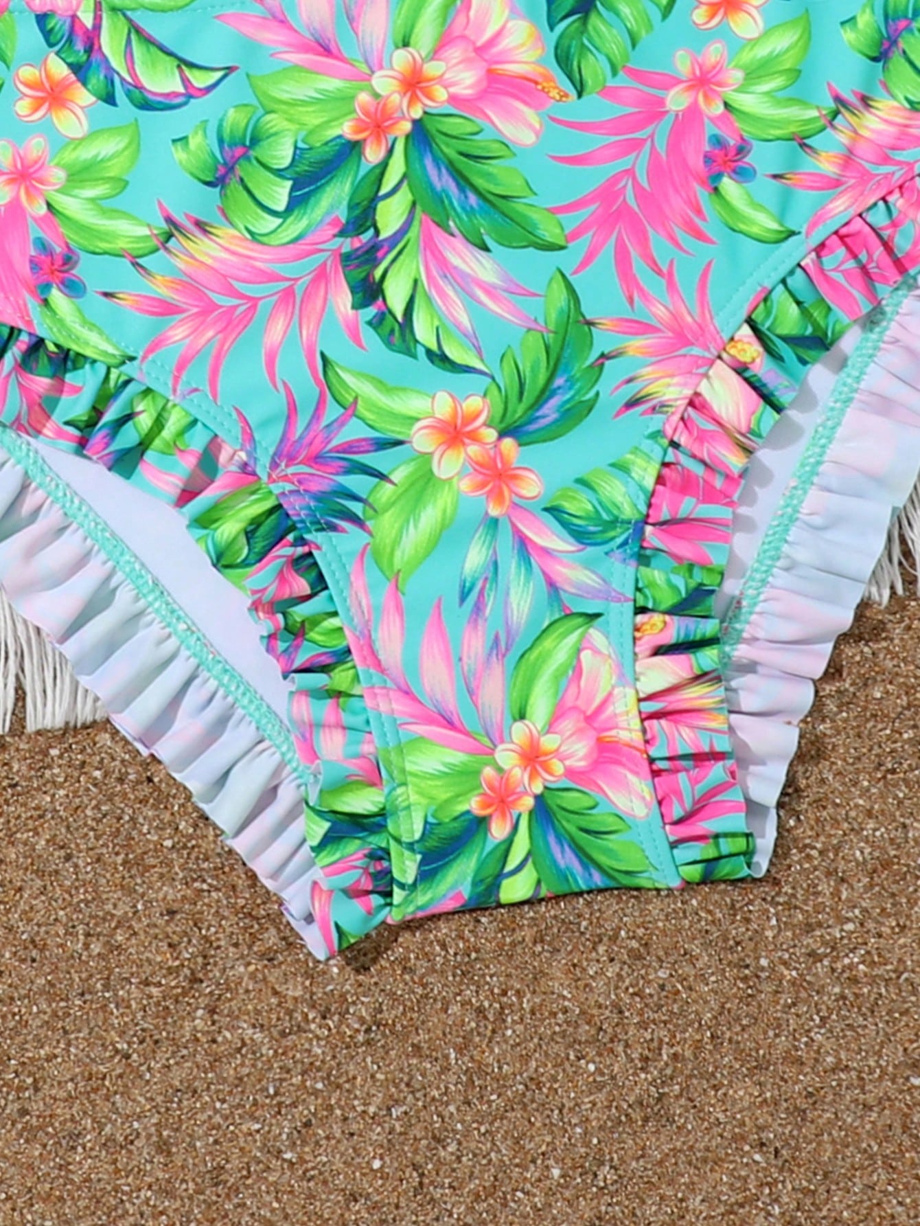 Tween girls solid color 2-piece bikini swimwear set with ruffle detail, strap neckline, wireless bikini top, and triangle mid-waist bikini bottoms; textured pattern with lined bottoms and high-stretch fabric, suitable for summer vacation.