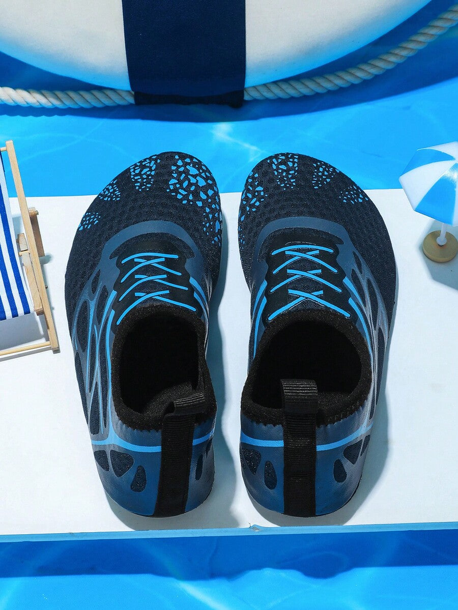 Multicolor boys' slip-on water shoes with geometric graphic pattern, breathable fabric upper, and non-slip TPR outsole.