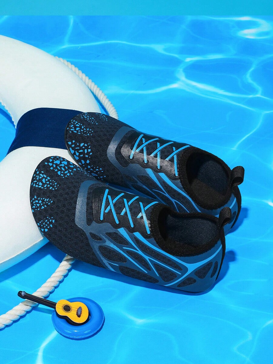 Multicolor boys' slip-on water shoes with geometric graphic pattern, breathable fabric upper, and non-slip TPR outsole.