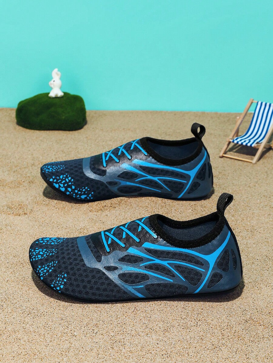 Multicolor boys' slip-on water shoes with geometric graphic pattern, breathable fabric upper, and non-slip TPR outsole.