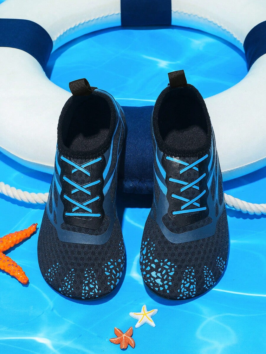 Multicolor boys' slip-on water shoes with geometric graphic pattern, breathable fabric upper, and non-slip TPR outsole.