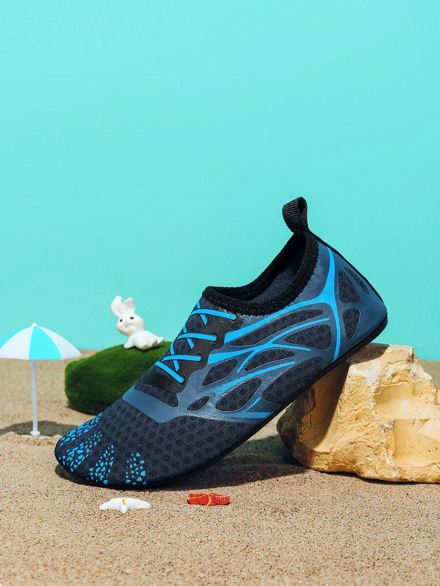 Multicolor boys' slip-on water shoes with geometric graphic pattern, breathable fabric upper, and non-slip TPR outsole.