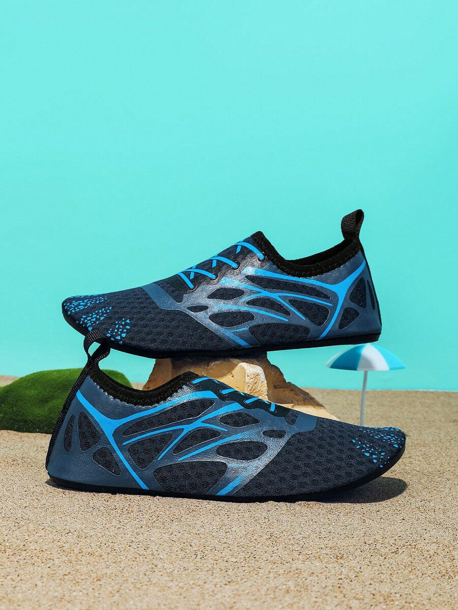 Multicolor boys' slip-on water shoes with geometric graphic pattern, breathable fabric upper, and non-slip TPR outsole.
