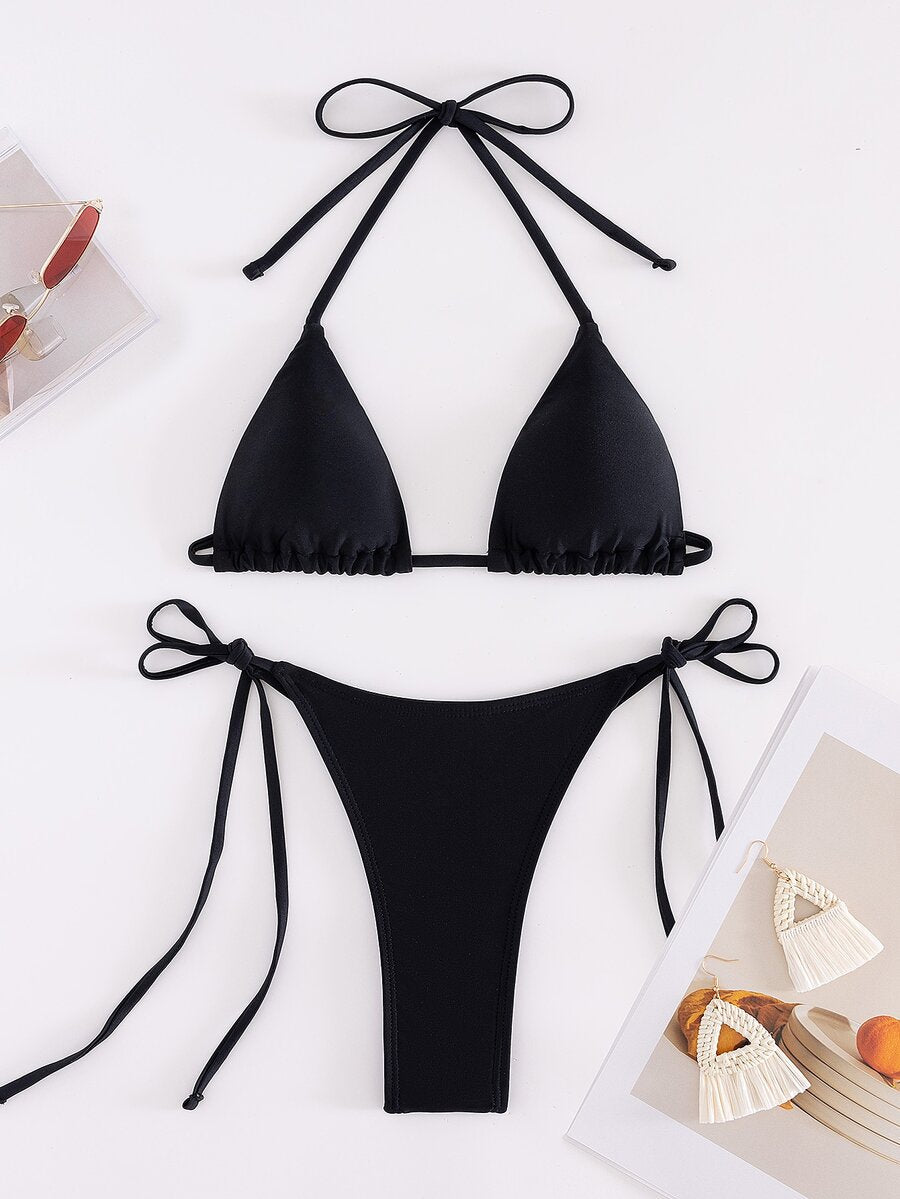 Women's two-piece bikini swimwear featuring a halter neck push-up top with tie-back details and low-waist tie-side swimsuit bottoms.