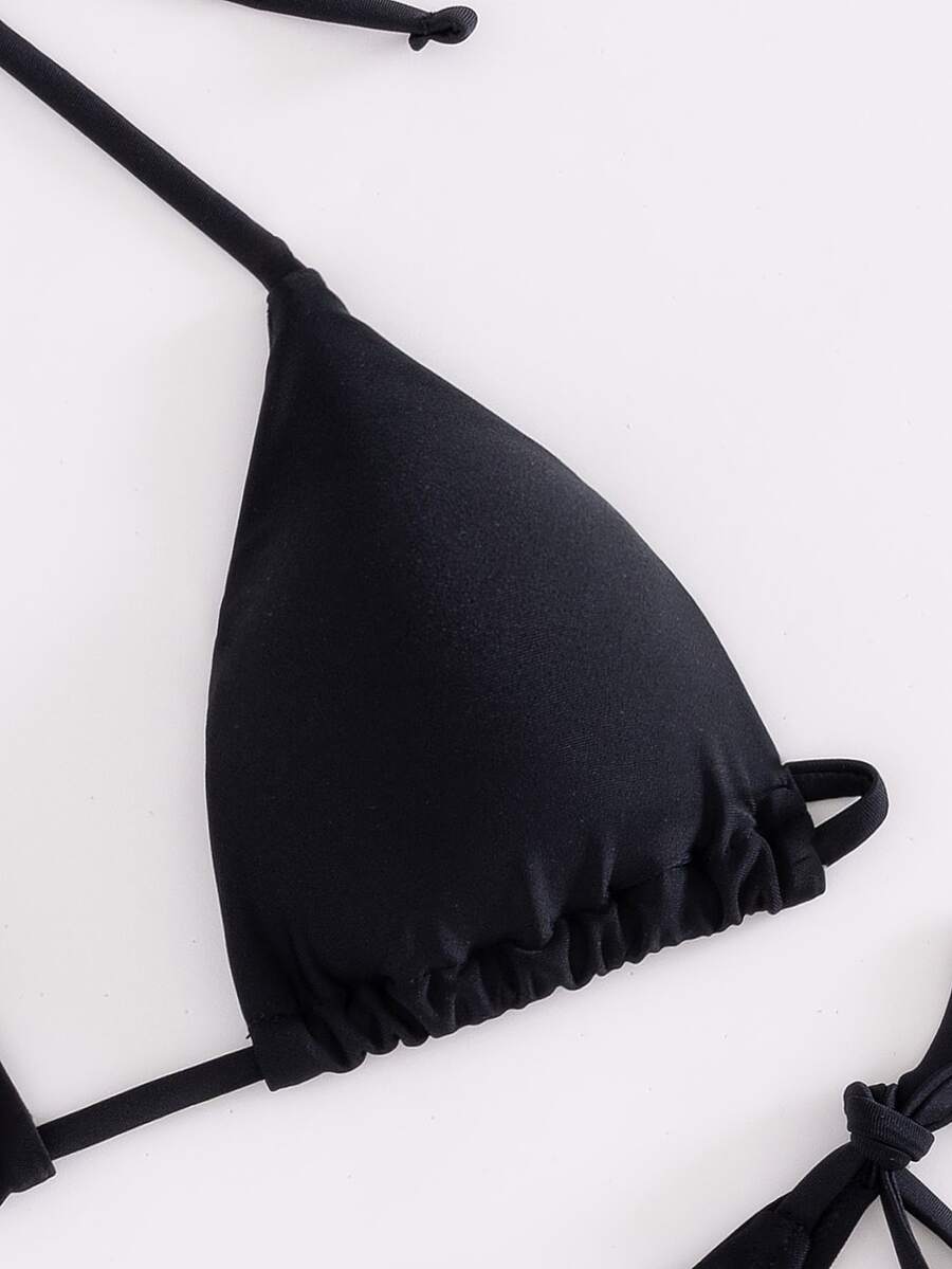Women's two-piece bikini swimwear featuring a halter neck push-up top with tie-back details and low-waist tie-side swimsuit bottoms.