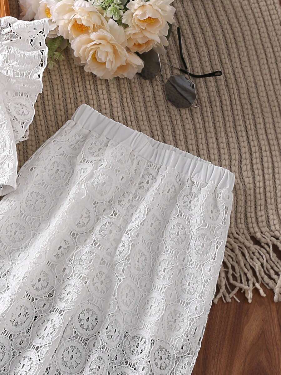 White 2-piece summer outfit set for tween girls featuring a sleeveless round neck ruffle trim lace top and matching cropped pants.