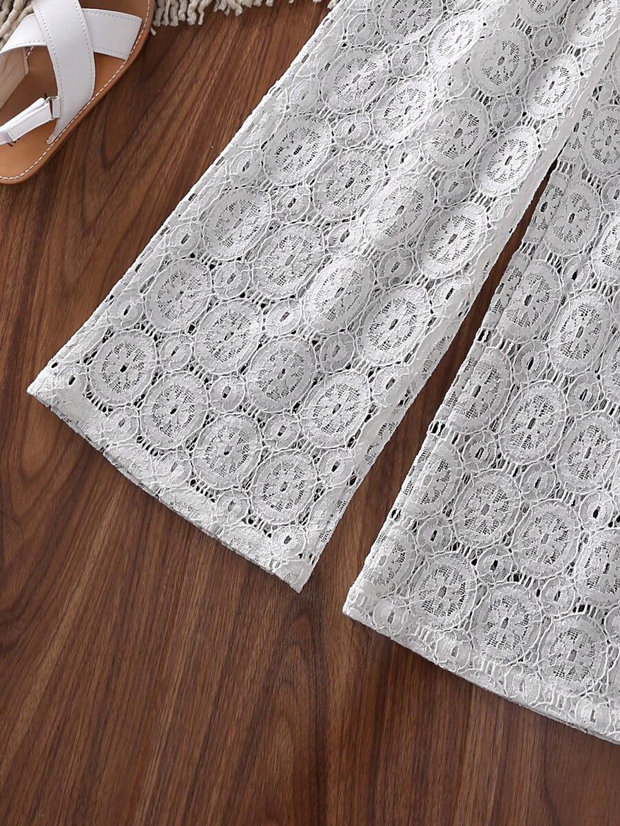 White 2-piece summer outfit set for tween girls featuring a sleeveless round neck ruffle trim lace top and matching cropped pants.
