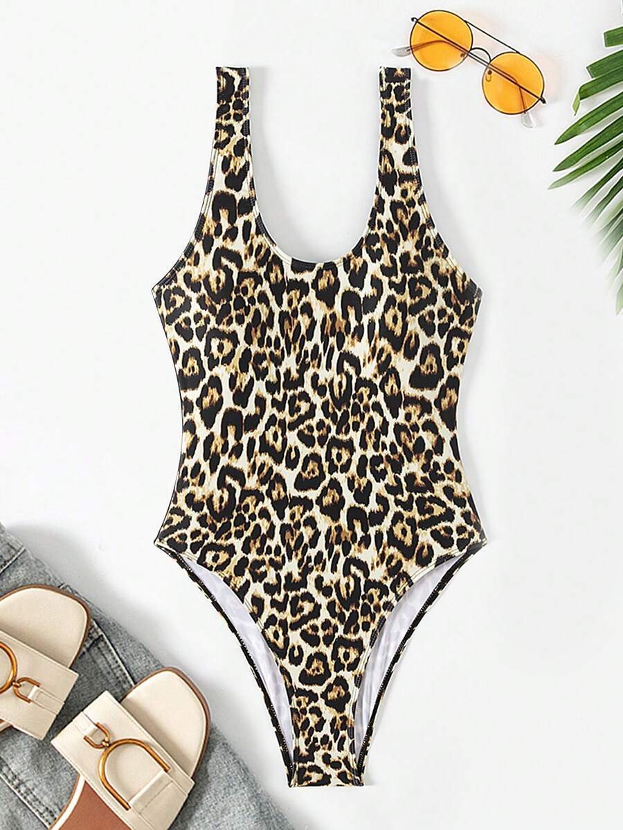Women's solid color one-piece swimsuit featuring a backless scoop neck design and high cut fit
