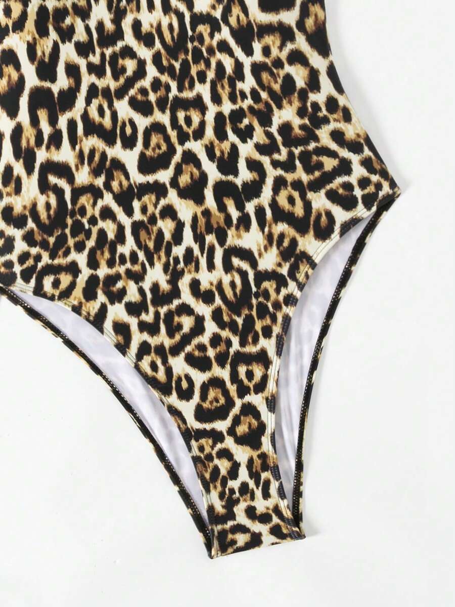 Women's solid color one-piece swimsuit featuring a backless scoop neck design and high cut fit
