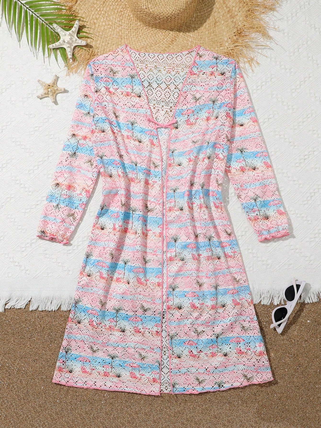 Tween girls' multicolor palm tree print kimono cardigan cover up featuring a button front, long sleeves, and knee-length sheer fabric.