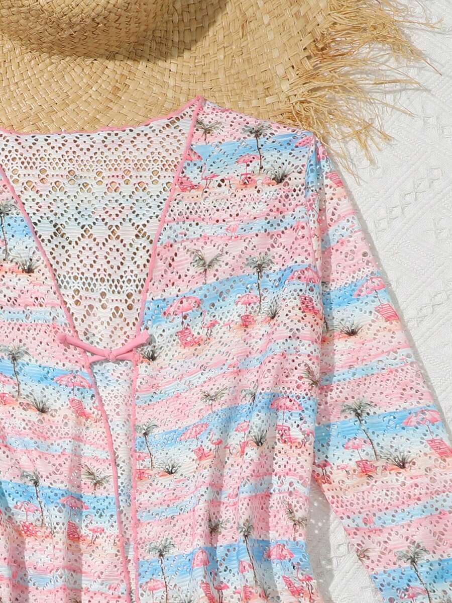 Tween girls' multicolor palm tree print kimono cardigan cover up featuring a button front, long sleeves, and knee-length sheer fabric.