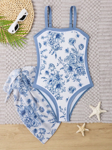 Tween girl multicolor floral one-piece swimsuit with asymmetrical spaghetti straps and knotted side swim skirt