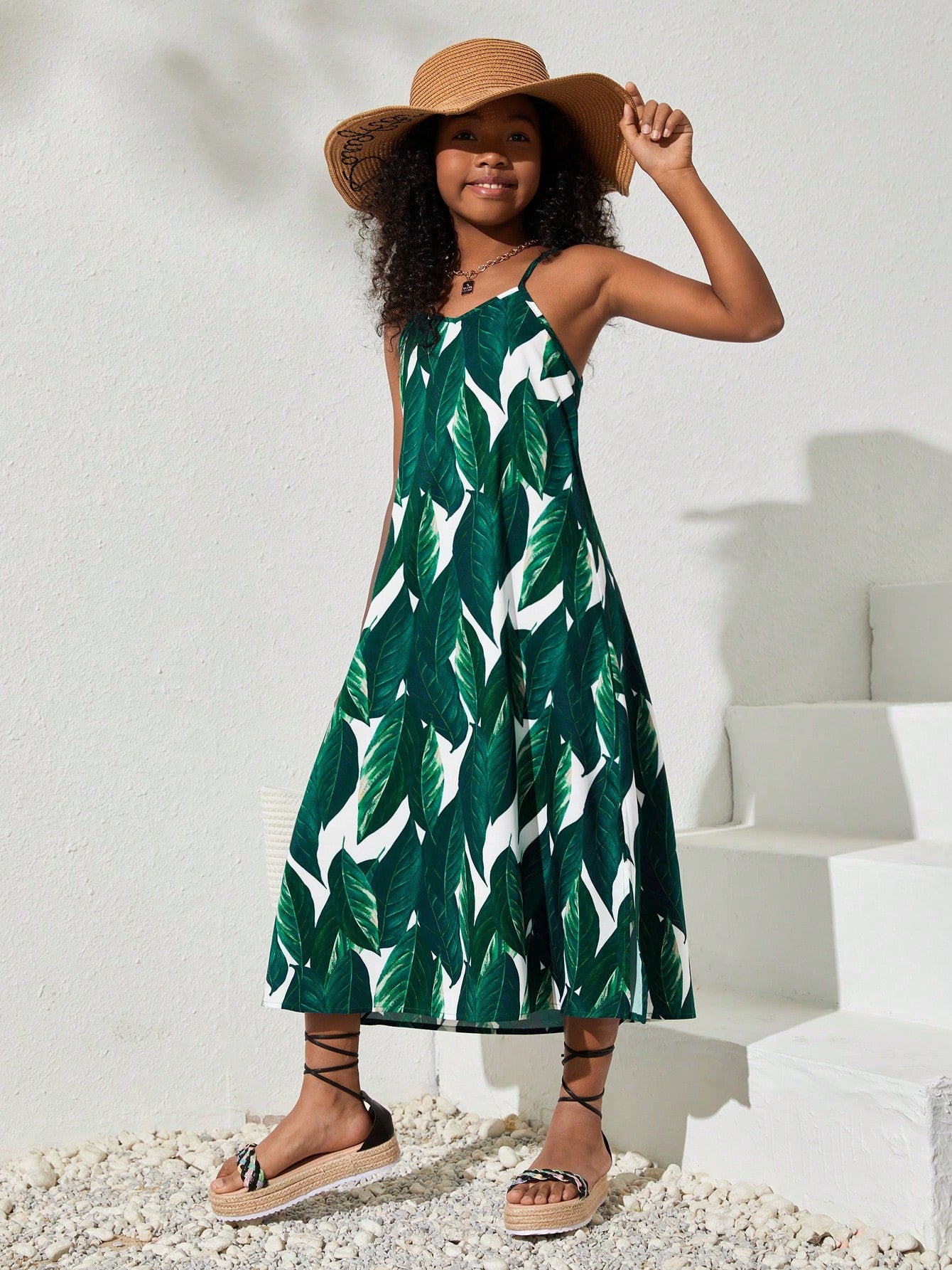 tween girls multicolor all-over printed spaghetti strap boho cami dress with sleeveless design, natural waist, flared hem, and long slim fit silhouette.