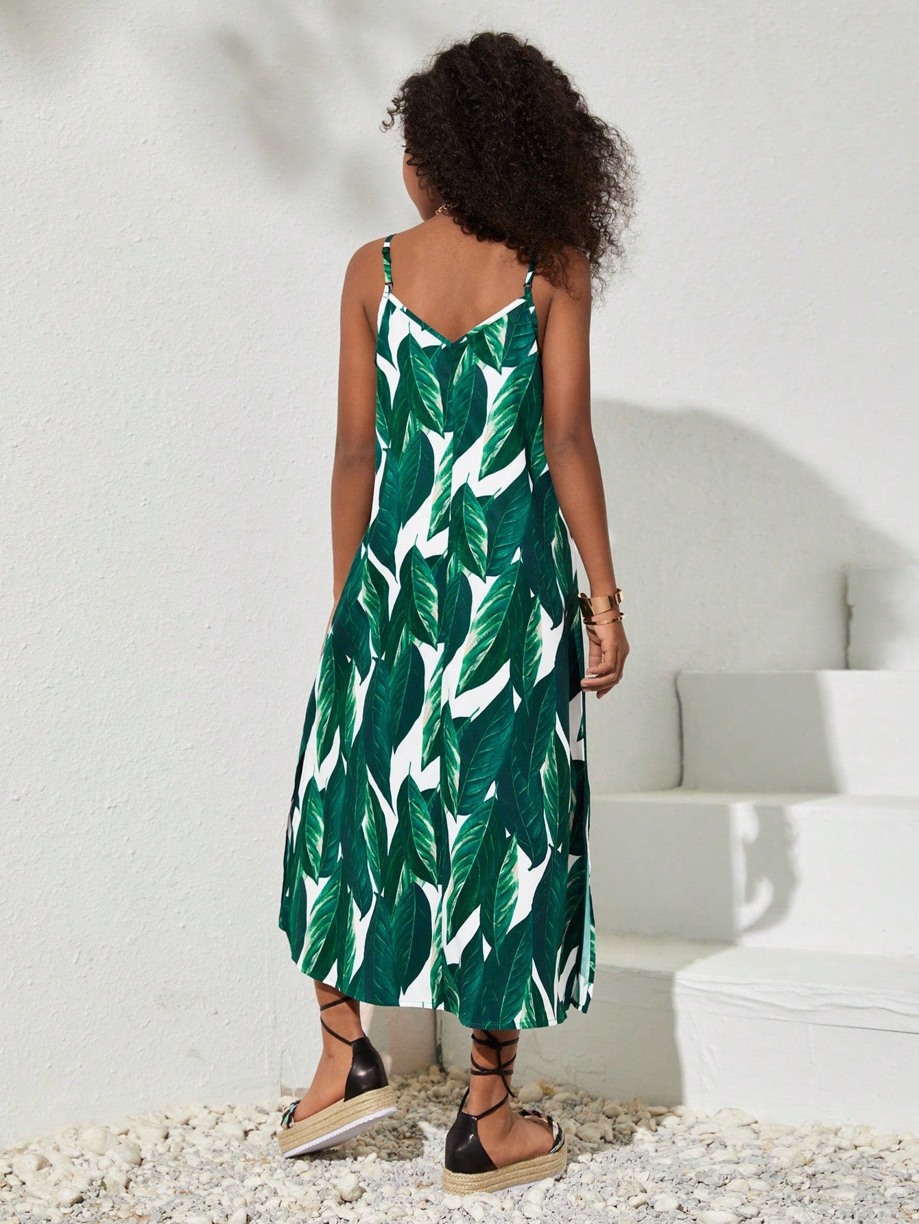 tween girls multicolor all-over printed spaghetti strap boho cami dress with sleeveless design, natural waist, flared hem, and long slim fit silhouette.