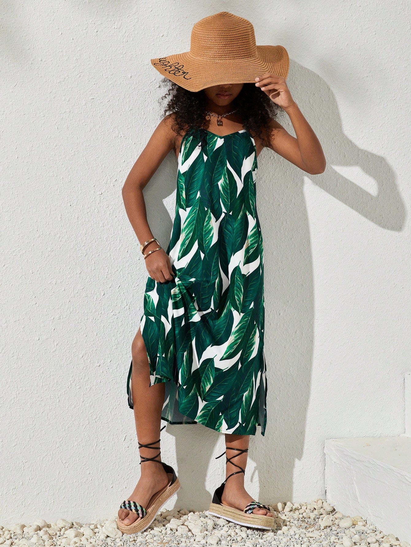 tween girls multicolor all-over printed spaghetti strap boho cami dress with sleeveless design, natural waist, flared hem, and long slim fit silhouette.