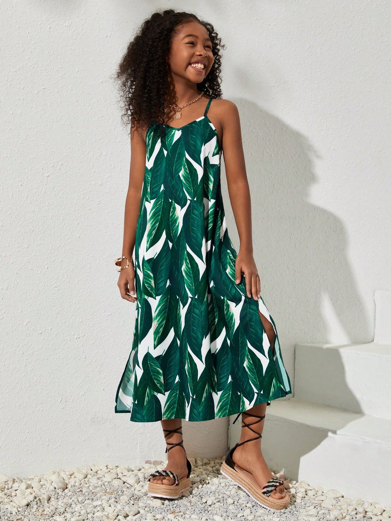tween girls multicolor all-over printed spaghetti strap boho cami dress with sleeveless design, natural waist, flared hem, and long slim fit silhouette.