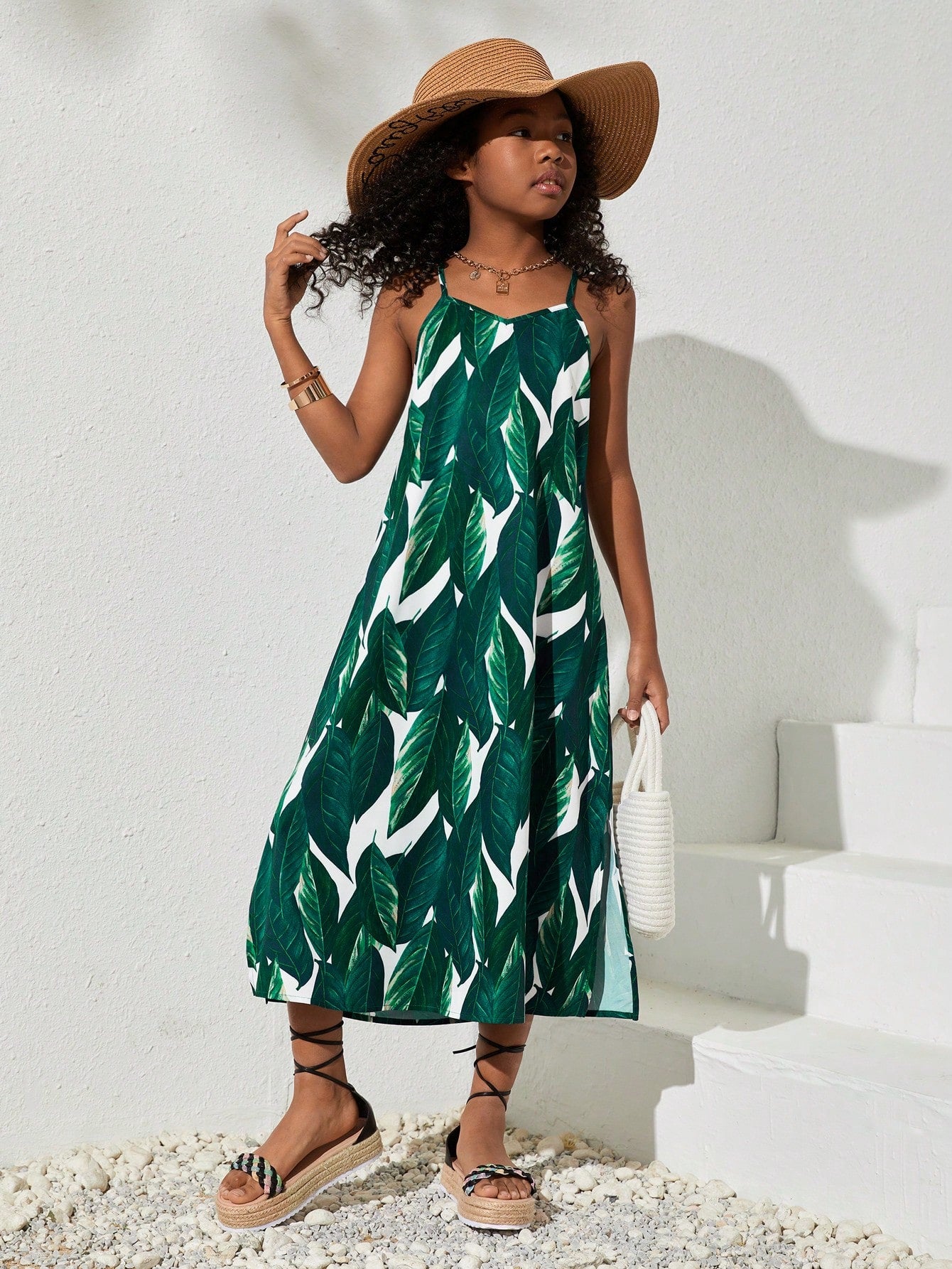 tween girls multicolor all-over printed spaghetti strap boho cami dress with sleeveless design, natural waist, flared hem, and long slim fit silhouette.