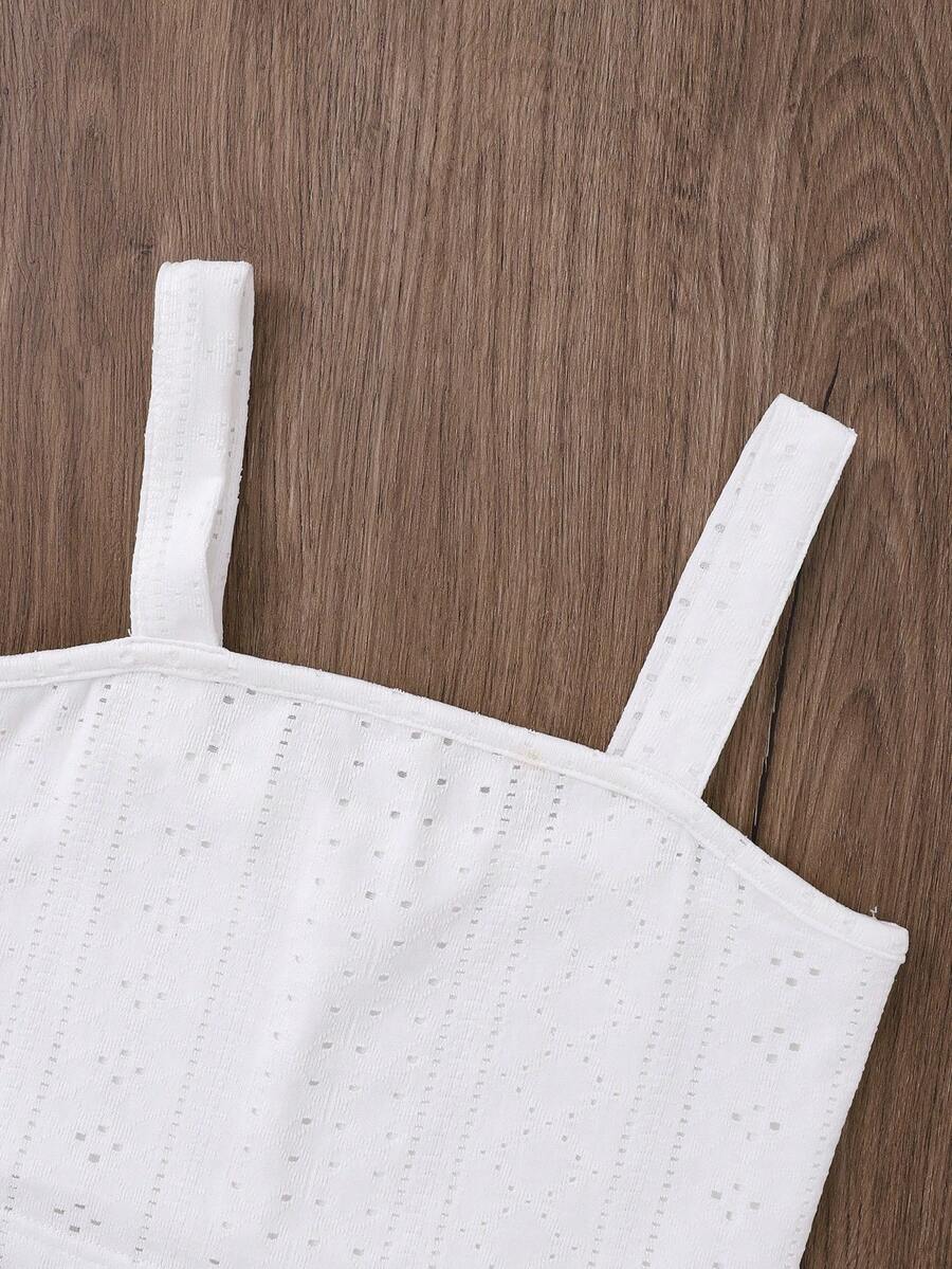 White 2-piece knit outfit for tween girls featuring a strap camisole top and tiered eyelet embroidery skirt with shirred details.