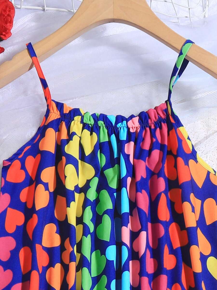 Multicolor geometric print cami midi dress for tween girls featuring spaghetti straps and a flared hem.