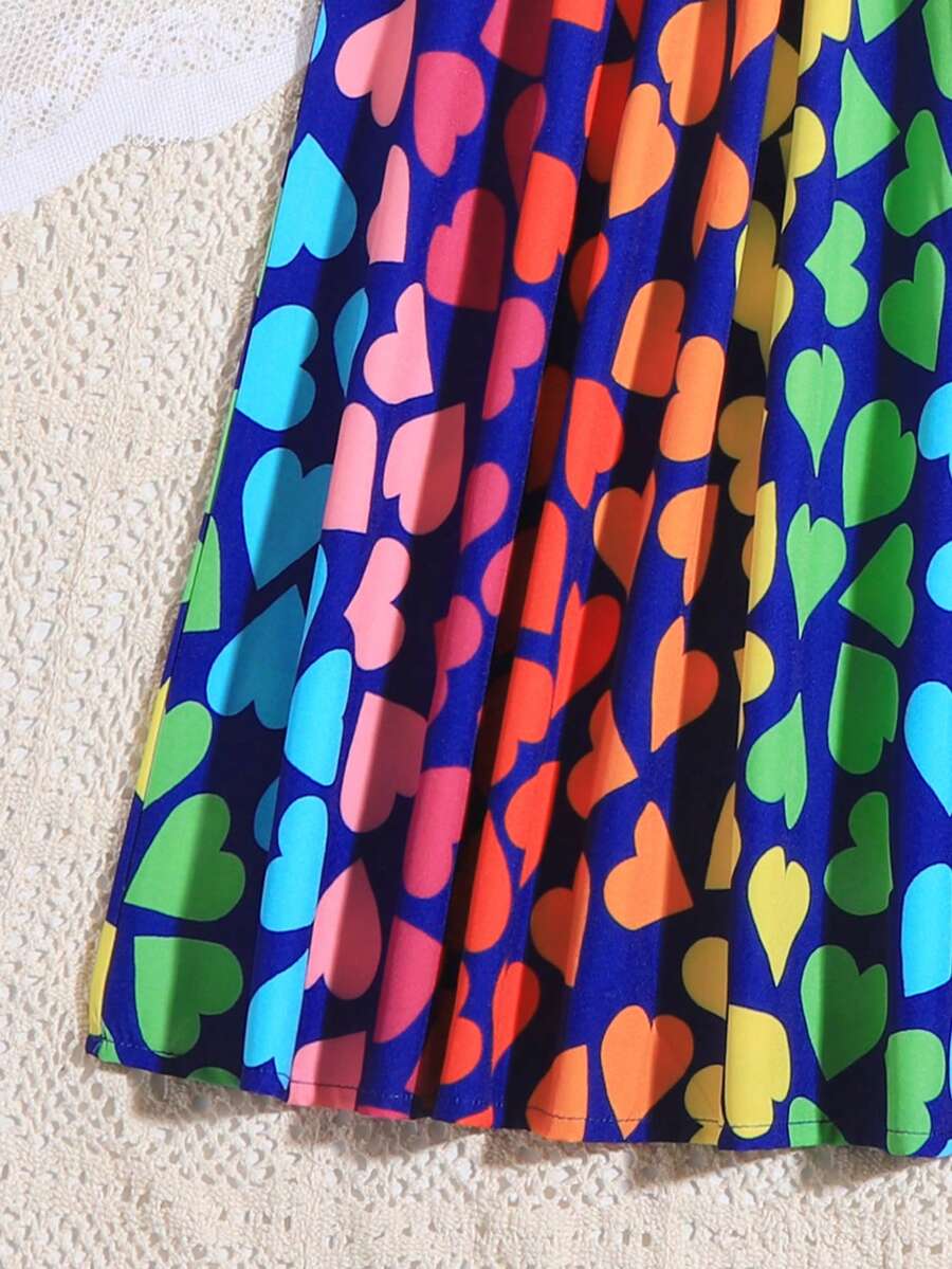 Multicolor geometric print cami midi dress for tween girls featuring spaghetti straps and a flared hem.