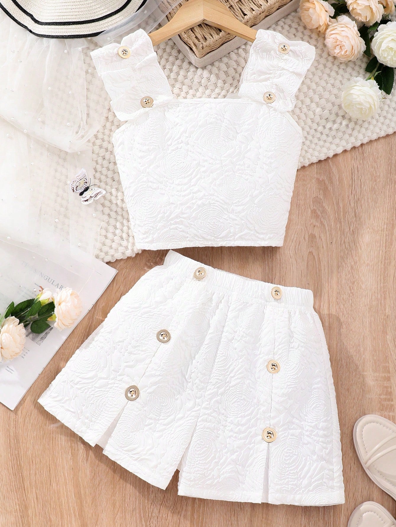 Apricot two-piece summer outfit for tween girls featuring a sleeveless pleated square-neck camisole top with button details and matching gathered shorts.