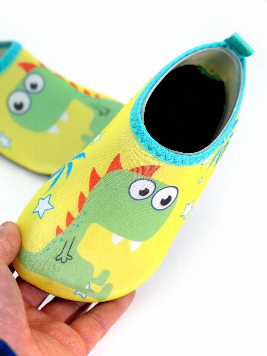 Multicolor cartoon dinosaur kids water shoes with breathable slip-on design and non-slip rubber outsole for boys.