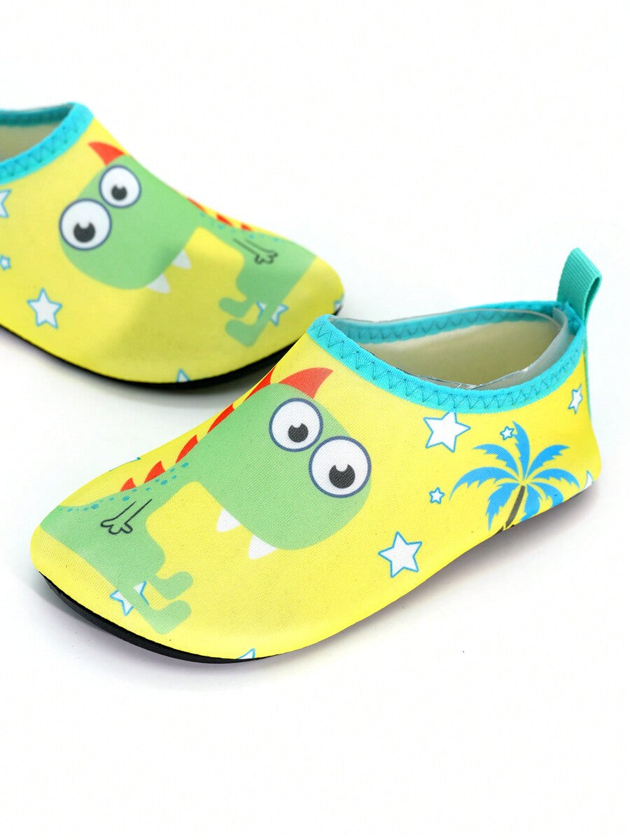 Multicolor cartoon dinosaur kids water shoes with breathable slip-on design and non-slip rubber outsole for boys.