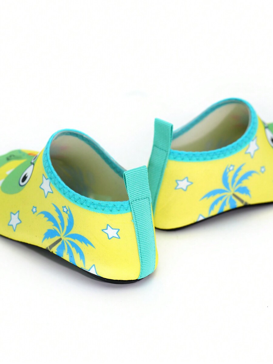 Multicolor cartoon dinosaur kids water shoes with breathable slip-on design and non-slip rubber outsole for boys.