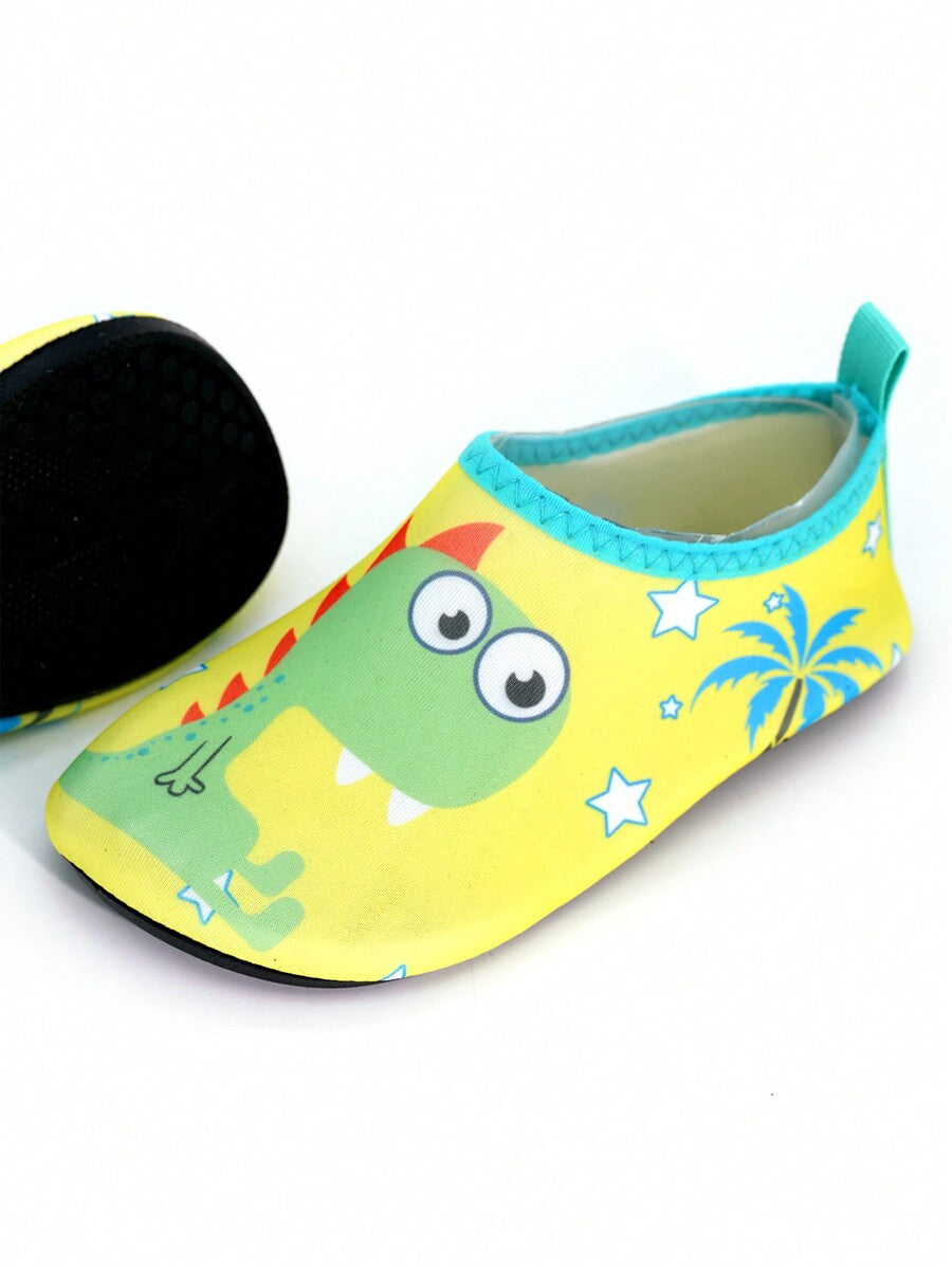 Multicolor cartoon dinosaur kids water shoes with breathable slip-on design and non-slip rubber outsole for boys.
