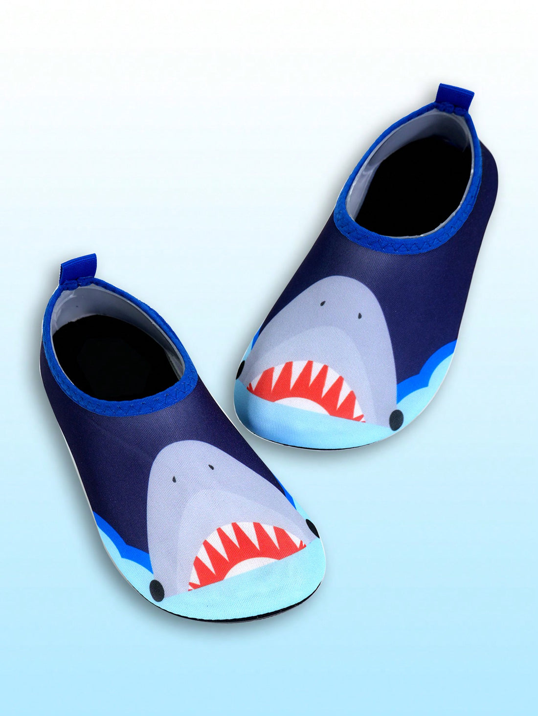 Multicolor cartoon pattern boys' aqua socks with breathable polyester upper, slip-on closure, and non-slip TPR outsole.