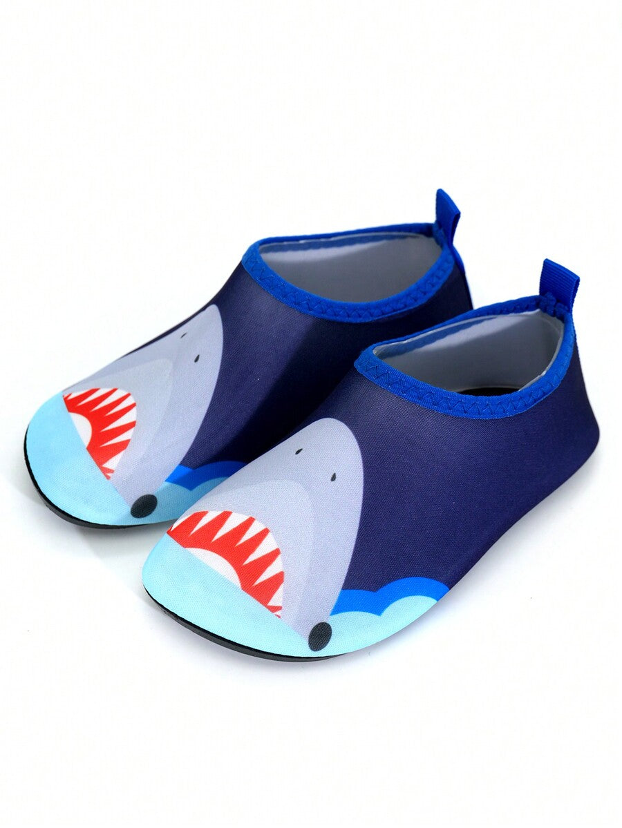 Multicolor cartoon pattern boys' aqua socks with breathable polyester upper, slip-on closure, and non-slip TPR outsole.