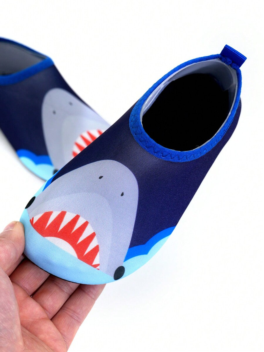 Multicolor cartoon pattern boys' aqua socks with breathable polyester upper, slip-on closure, and non-slip TPR outsole.