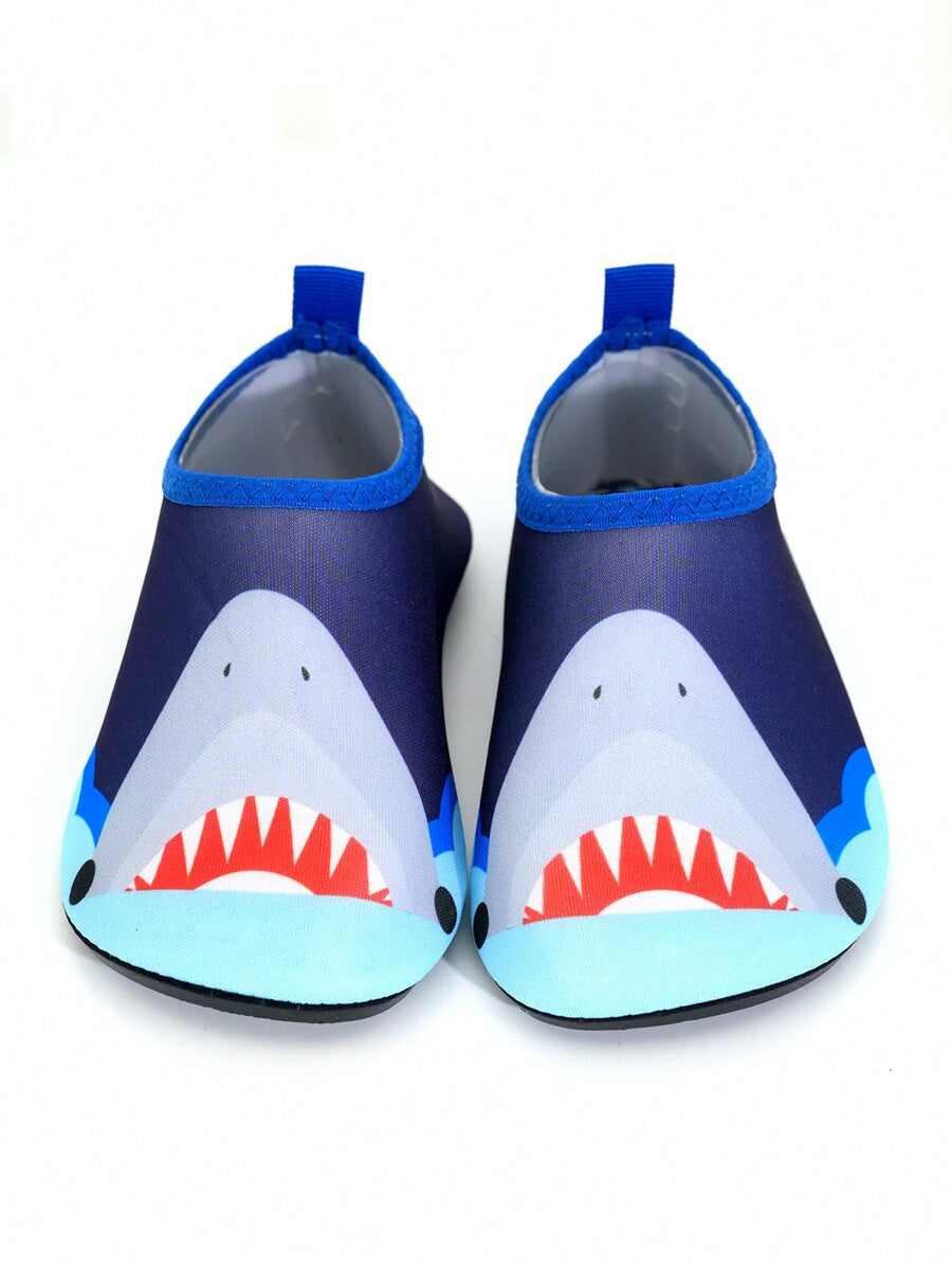 Multicolor cartoon pattern boys' aqua socks with breathable polyester upper, slip-on closure, and non-slip TPR outsole.