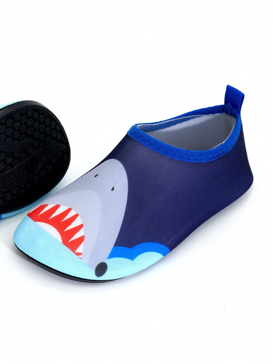 Multicolor cartoon pattern boys' aqua socks with breathable polyester upper, slip-on closure, and non-slip TPR outsole.