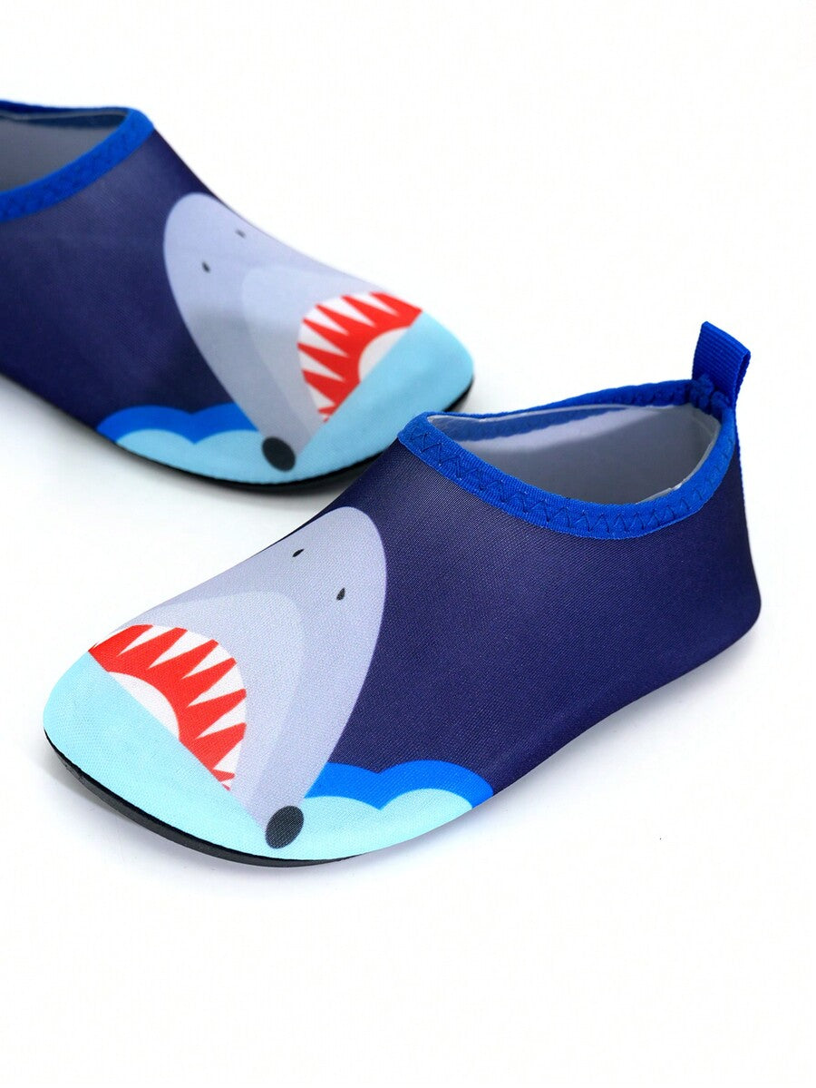 Multicolor cartoon pattern boys' aqua socks with breathable polyester upper, slip-on closure, and non-slip TPR outsole.
